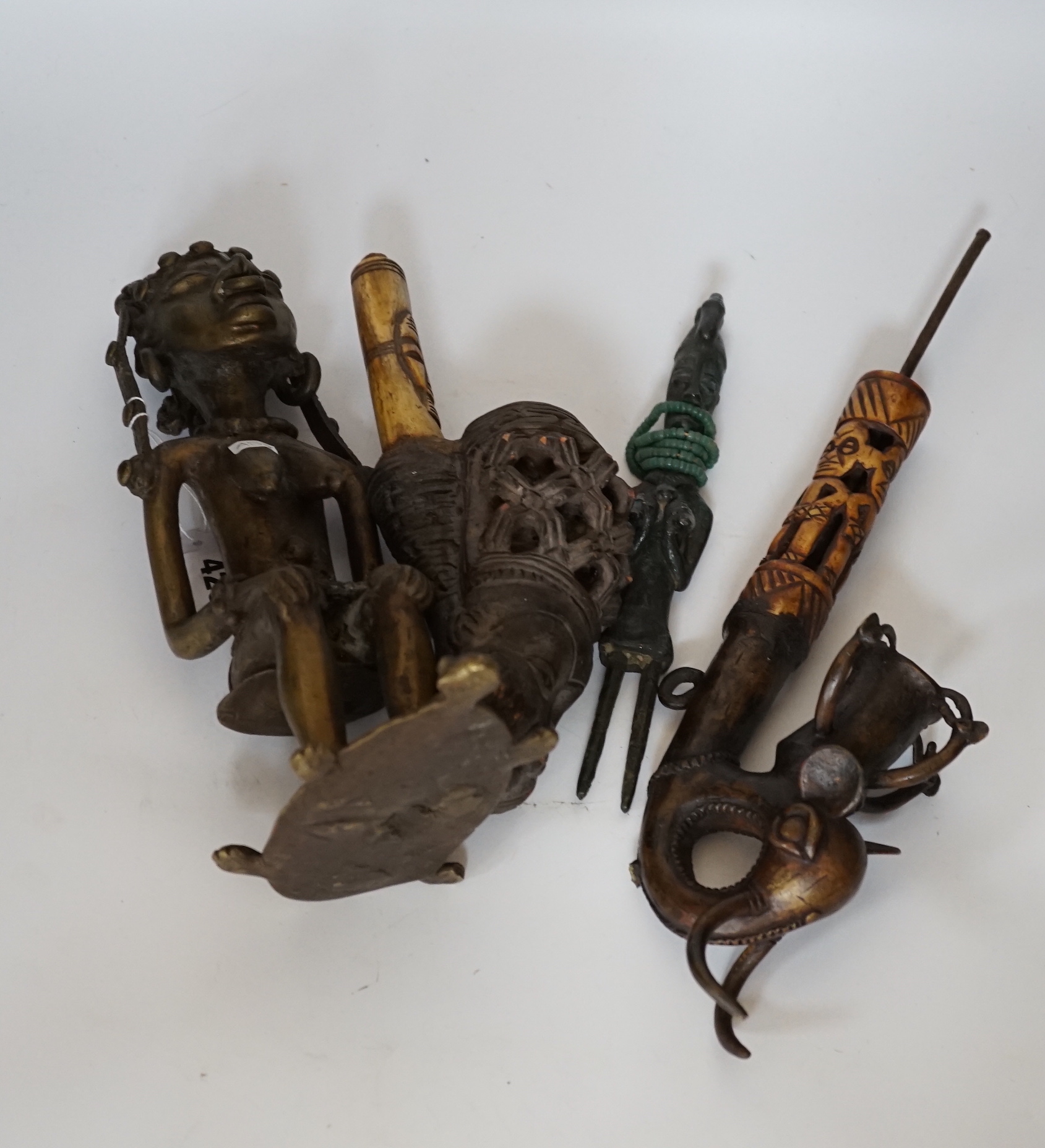 Two Bamoun bronze and bone pipes, another larger, and two figures, largest item 60cms long